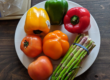 peppers and asparagus on a white plate
