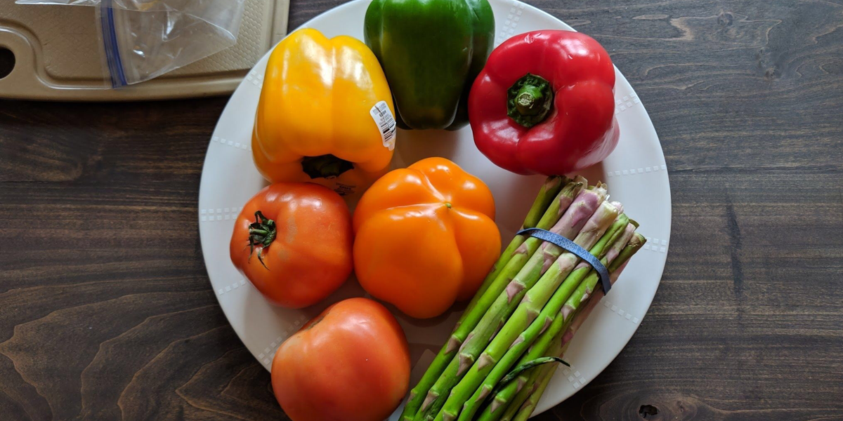 peppers and asparagus on a white plate