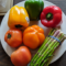 peppers and asparagus on a white plate