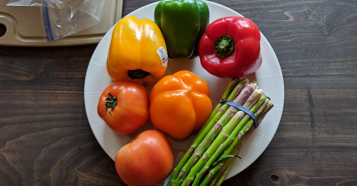 peppers and asparagus on a white plate